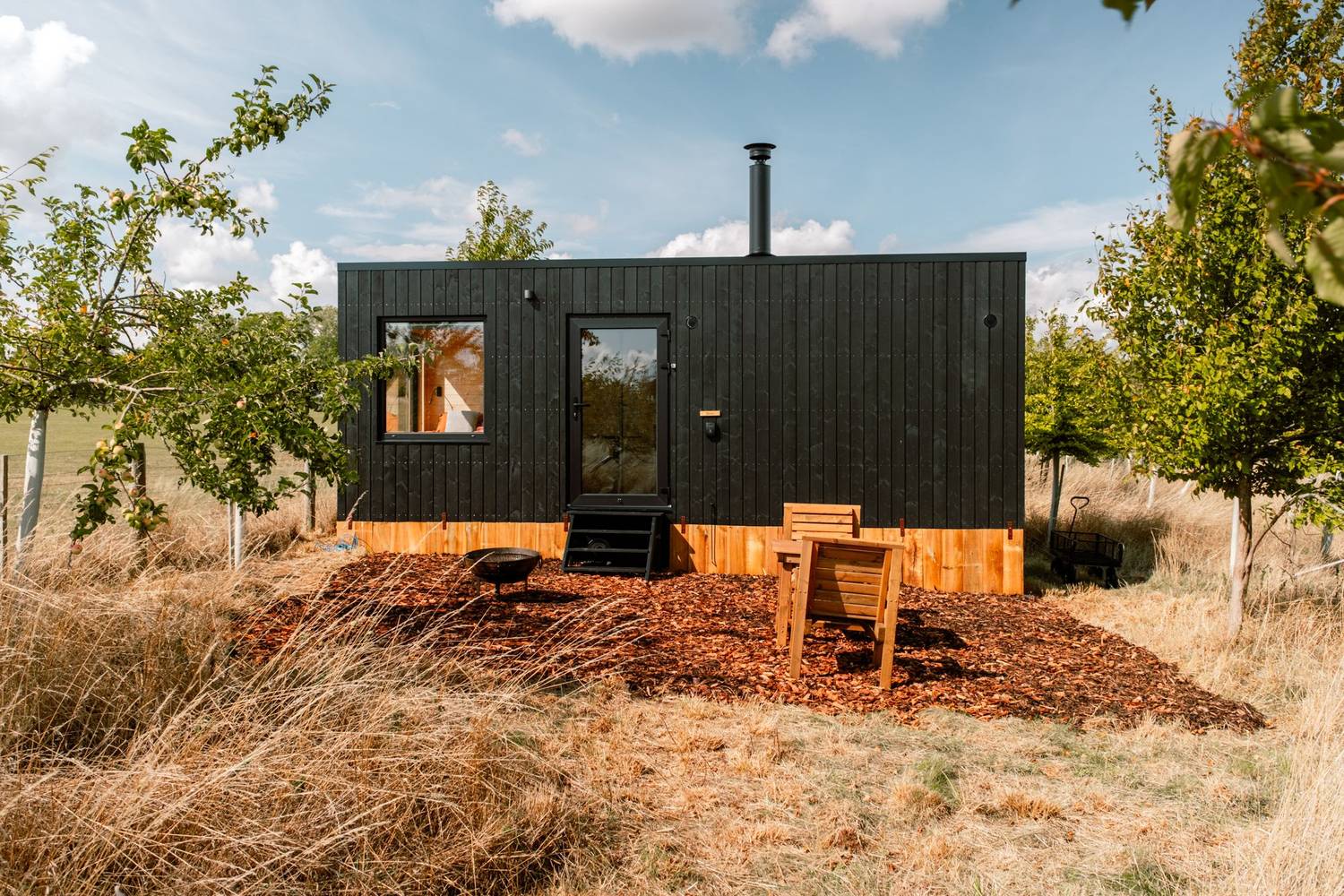 Off-grid cabin at the edge of a field